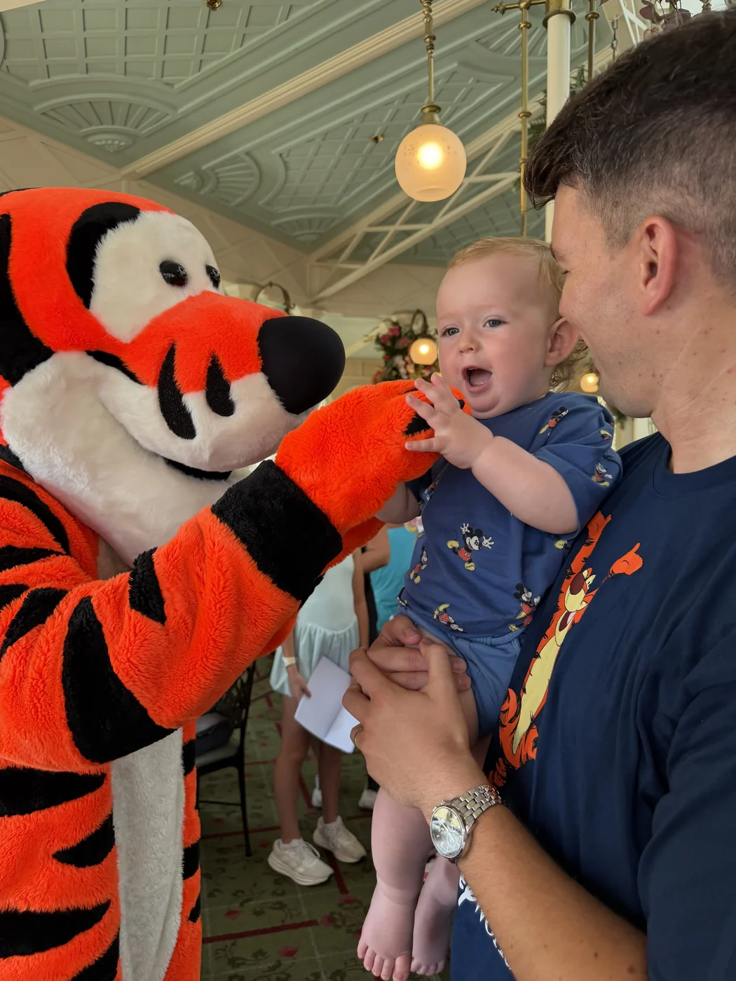 George holding Tigger’s paw while Adam holds him at The Crystal Palace