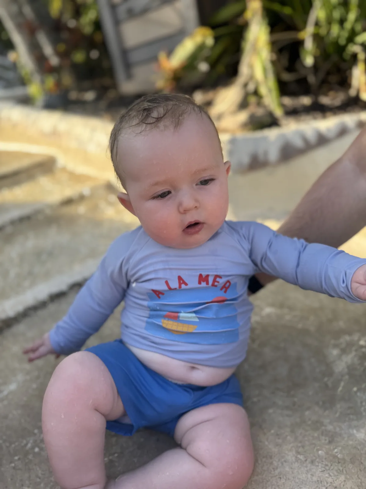 George in his blue swim outfit on his first Florida trip in January