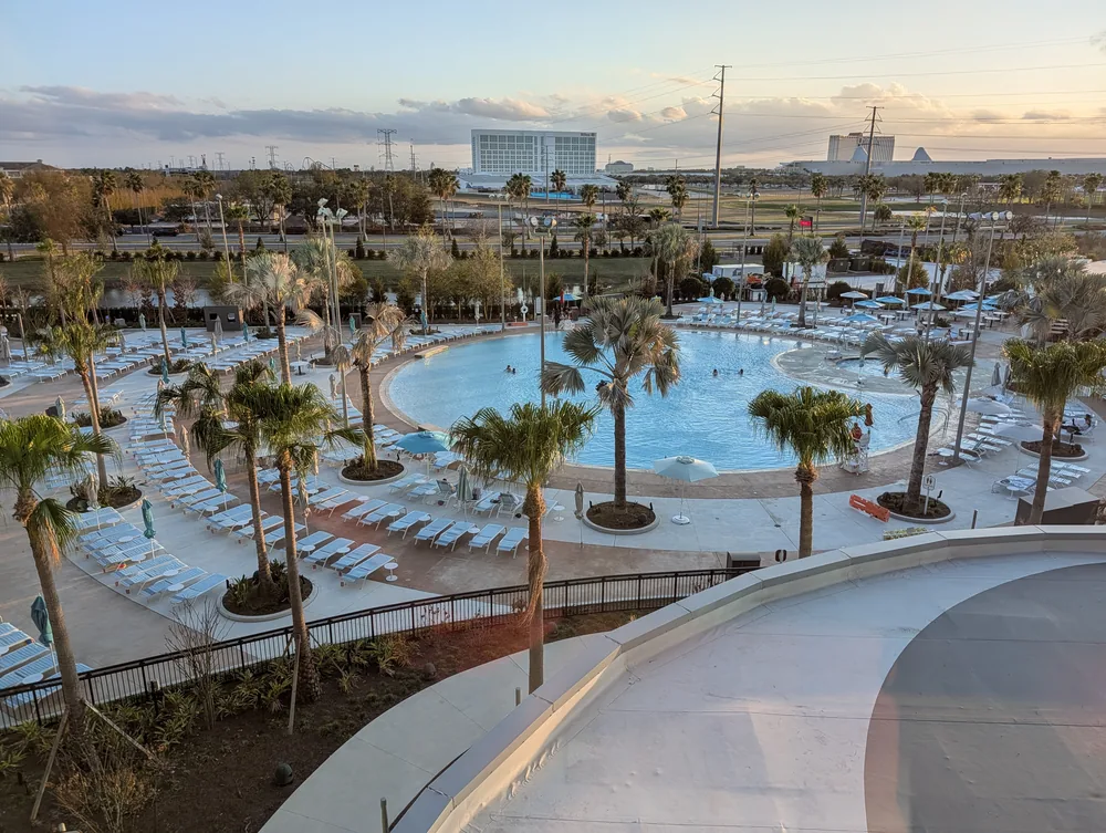 The swimming pool, palm trees and sun terrace at Universal Terra Luna Resort.